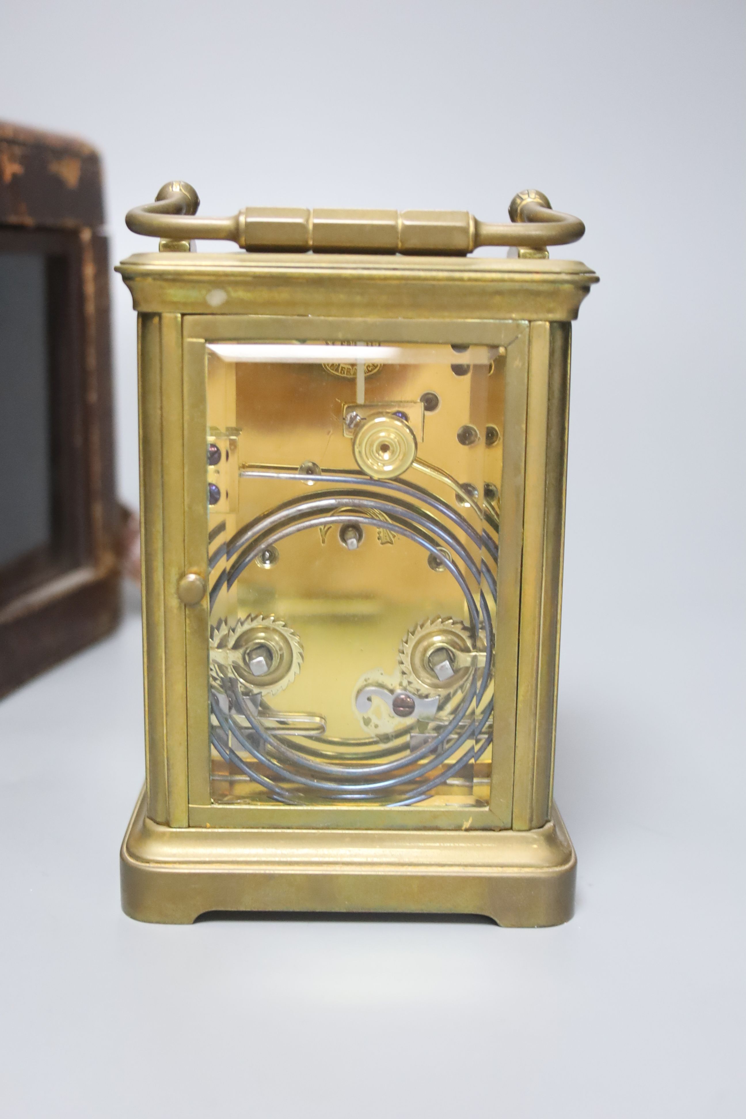 An early 20th century French lacquered brass carriage clock, with enamelled dial, cased, overall height 16cm